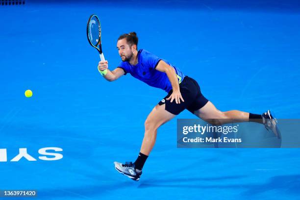 Viktor Durasovic of Norway plays a shot in his match against Andy Murray of Great Britain during day three of the Sydney Tennis Classic at Sydney...