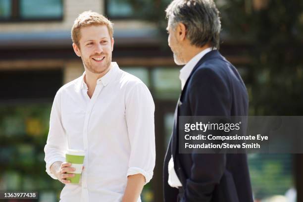 businessmen talking in city - smith street stock pictures, royalty-free photos & images