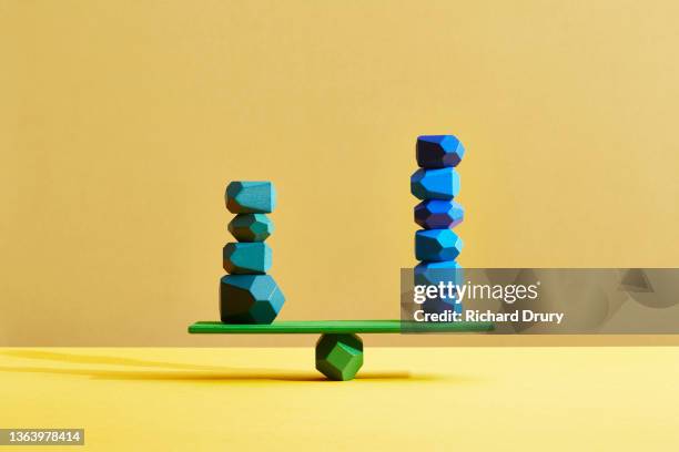 conceptual image of geometric pebbles - compare stock-fotos und bilder