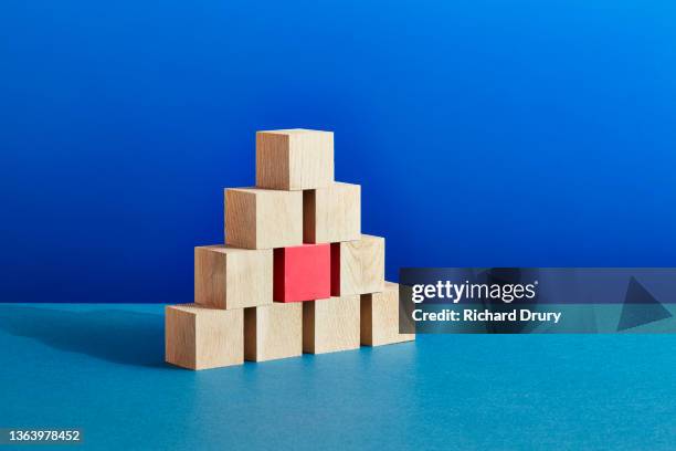 conceptual image of geometric blocks - bloque de madera fotografías e imágenes de stock