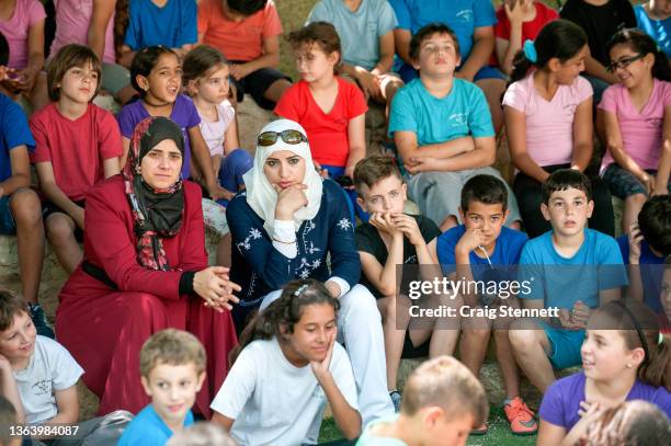 Arab and Jewish Israeli students and some of their staff watching the end of term children's sports events day at the Wadi Ara Hand in Hand School on...