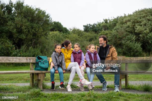 family taking a break - triplet stock pictures, royalty-free photos & images