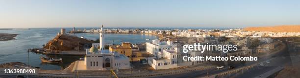 harbor at sunset, sur, oman - golfe persique photos et images de collection