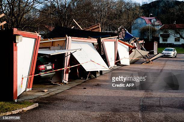 Car are parked in garages destroyed by a winter storm in Goteborg on January 4, 2012. Winds of 31 metres per second were recorded at the west coast...
