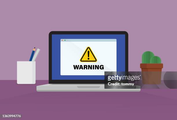 warnschild auf einem laptop - white collar crime stock-grafiken, -clipart, -cartoons und -symbole