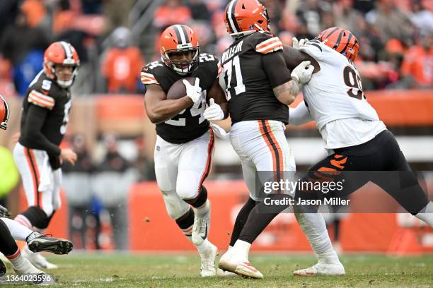 Running back Nick Chubb runs for a gain as offensive tackle Jedrick Wills of the Cleveland Browns blocks defensive tackle Renell Wren of the...