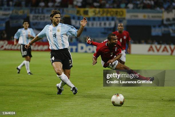 Ashley Cole of England is brought down by Mauricio Pochettino of Argentina during the England v Argentina, Group F, World Cup Group Stage match...