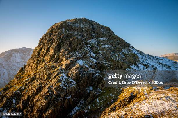 pike o stickle at dusk,low angle view of mountain against clear sky,pike of stickle,ambleside,united kingdom,uk - pike o stickle stock pictures, royalty-free photos & images