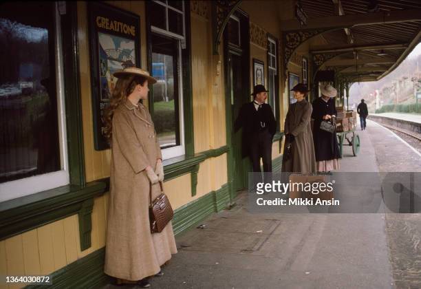 View of unidentified background actors on the platform at the Horsted Keynes train station during the filming of 'Maurice' , Haywards Heath, England,...