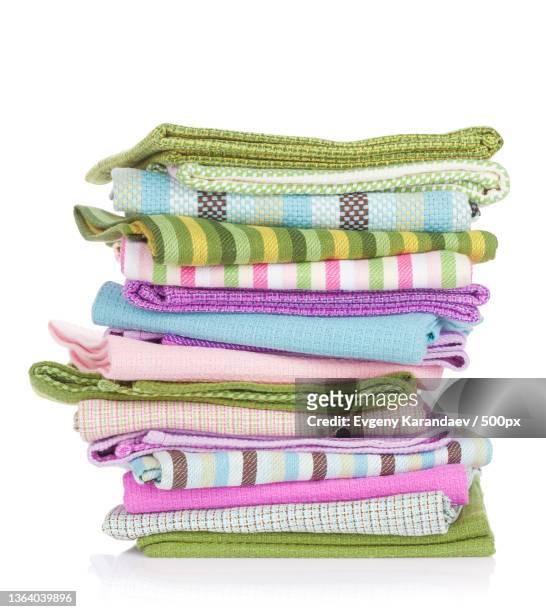kitchen towels,close-up of stacked towels against white background - tea towels stock pictures, royalty-free photos & images