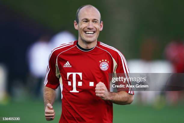 Arjen Robben smiles during a training session of Bayern Muenchen at the ASPIRE Academy for Sports Excellence on January 4, 2012 in Doha, Qatar.