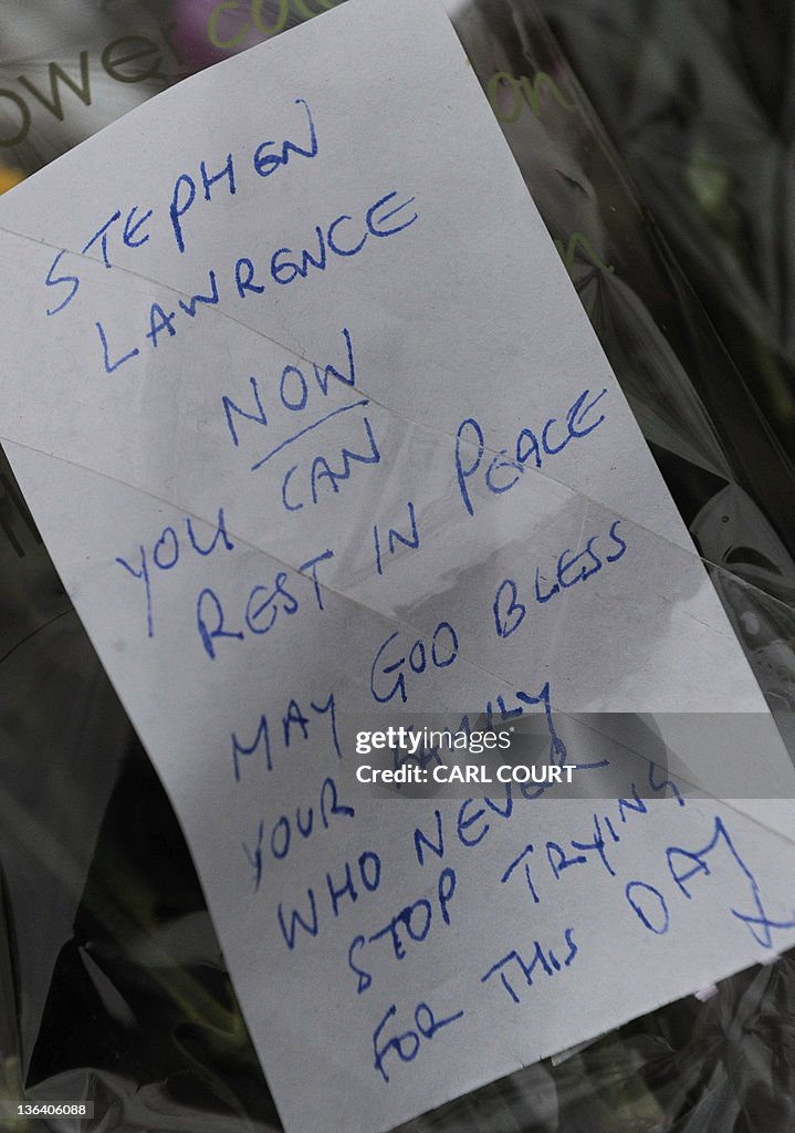 A written tribute is pictured amongst fl