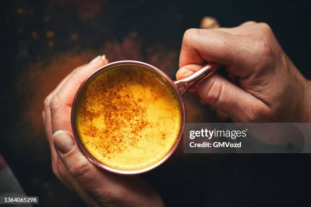 healthy golden milk with turmeric - ayurveda stock pictures, royalty-free photos & images