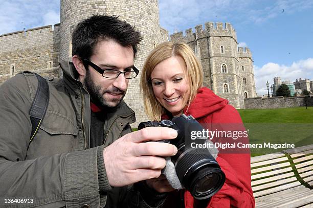 Two photographers comparing pictures of Windsor Castle on a Canon EOS 450D camera, on March 6, 2009.