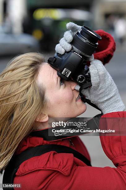 An amateur photographer with a Canon EOS 450D camera taking pictures around Windsor, on March 6, 2009.