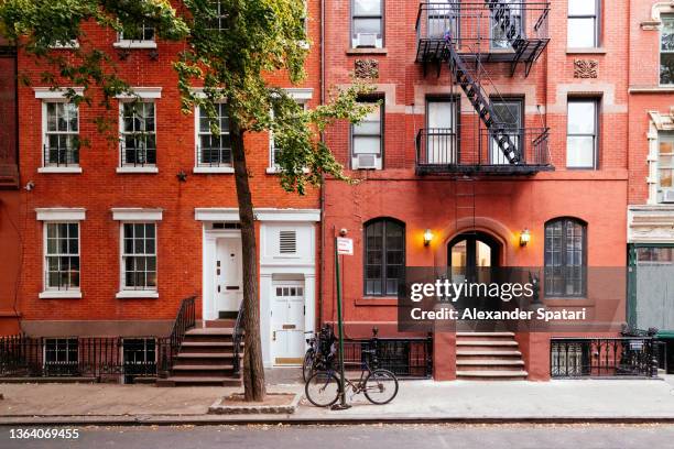 street in west village, manhattan, new york city, usa - red brick apartments stock pictures, royalty-free photos & images