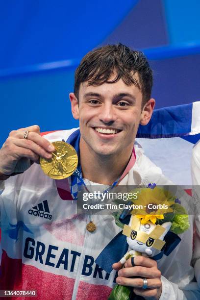 Tom Daley of Great Britain with his gold medal won with team mate Matty Lee of Great Britain in the Men's Synchronised 10m Platform Diving at the...