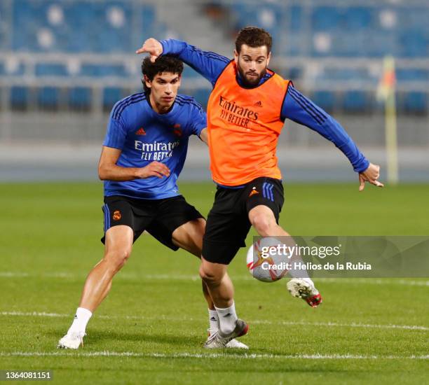 Nacho Fernández and Manu Vallejo players of Real Madrid are training at Riyadh's King Fahd Stadium on January 11, 2022 in Arabia Saudí.