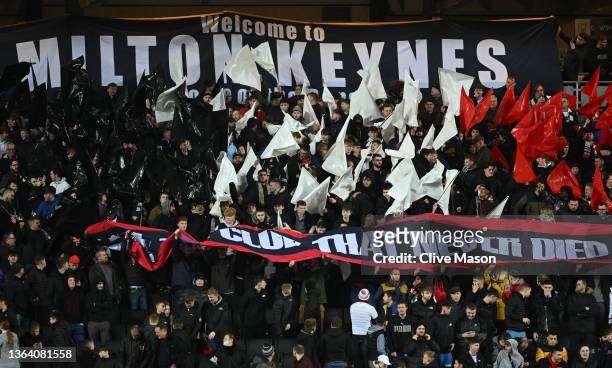 General view of MK Dons fans as they hold up a banner saying ' the club that never died 'during the Sky Bet League One match between Milton Keynes...
