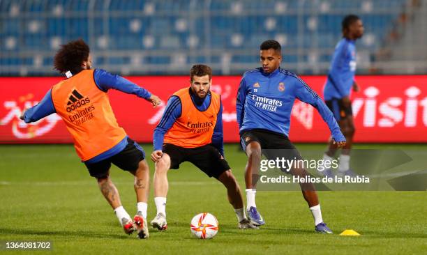 Marcelo Silva, Naho Fernández and Rodrygo Goes players of Real Madrid are training at Riyadh's King Fahd Stadium on January 11, 2022 in Arabia Saudí.