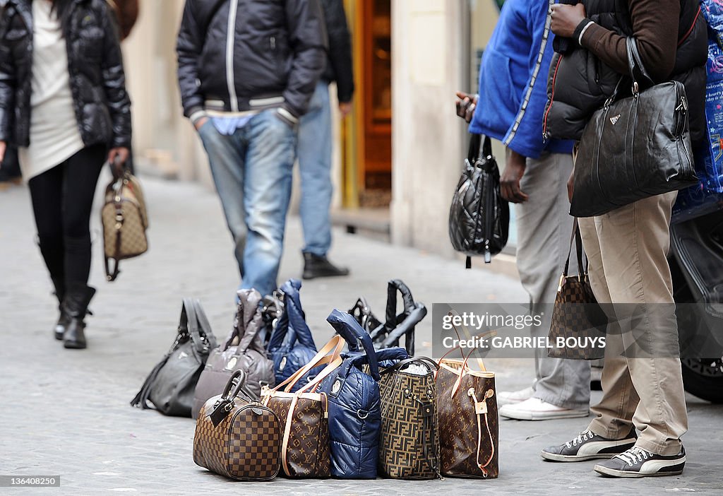 Fake designer bags are displayed by vend