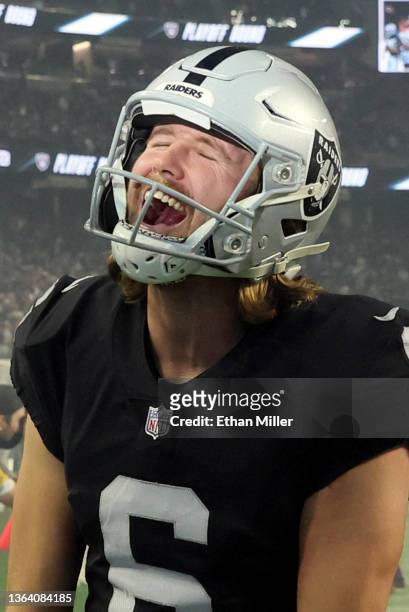 Punter A.J. Cole of the Las Vegas Raiders celebrates as he runs off the field after the team's 35-32 overtime victory over the Los Angeles Chargers...