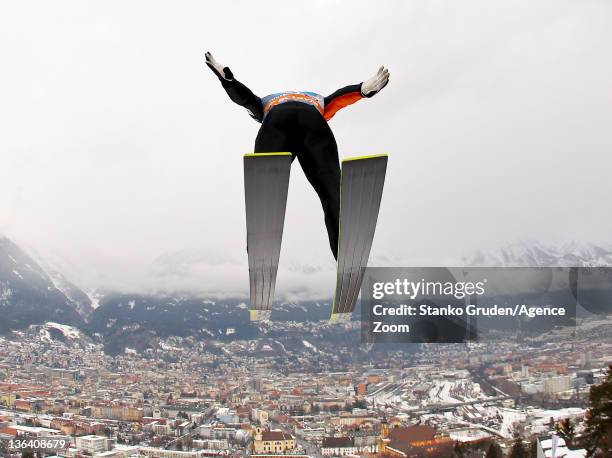 Taku Takeuchi of Japan competes to take third place during the FIS Ski Jumping World Cup Vierschanzentournee on January 4, 2012 in Innsbruck, Austria.