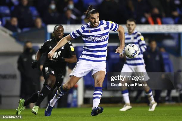 Andy Carroll of Reading passes the ball during the Sky Bet Championship match between Reading and Fulham at Madejski Stadium on January 11, 2022 in...