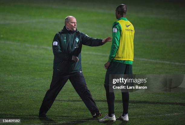 Head coach Thomas Schaaf gives instructions to Naldo during a training session at day one of Werder Bremen training camp on January 4, 2012 in Belek,...