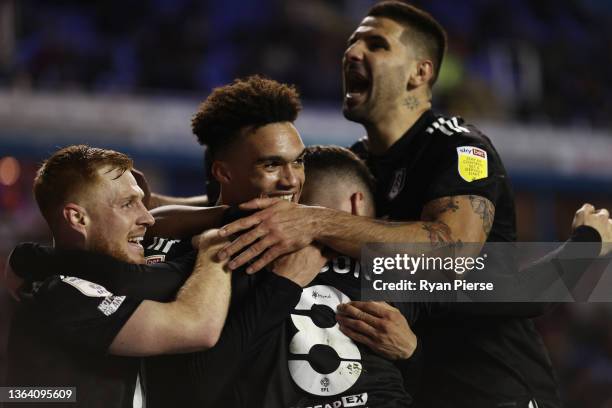 Harry Wilson of Fulham celebrates his team's third goal with teammates during the Sky Bet Championship match between Reading and Fulham at Madejski...