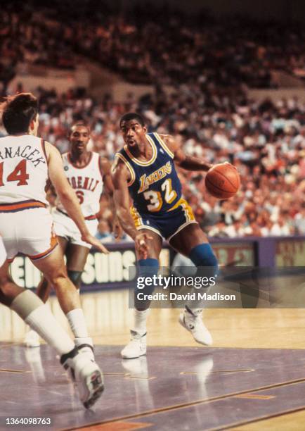 Magic Johnson of the Los Angeles Lakers plays in an NBA game against the Phoenix Suns on April 6, 1990 at the Arizona Veterans Memorial Coliseum in...
