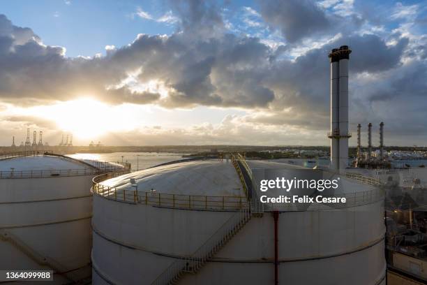 fuel storage tanks of a power plant system - malta business stock pictures, royalty-free photos & images
