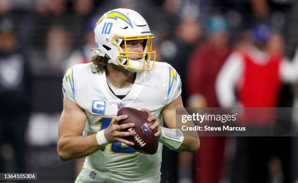 Quarterback Justin Herbert of the Los Angeles Chargers looks to pass during a game against the Las Vegas Raiders at Allegiant Stadium on January 09,...