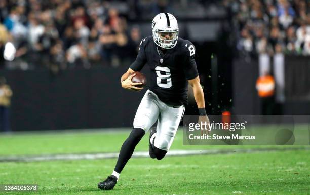 Quarterback Marcus Mariota of the Las Vegas Raiders runs with the ball during a game against the Los Angeles Chargers at Allegiant Stadium on January...