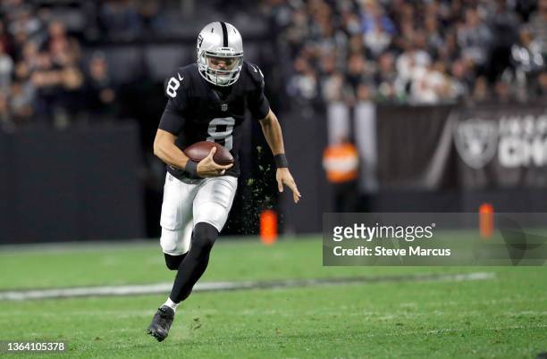 Quarterback Marcus Mariota of the Las Vegas Raiders runs with the ball during a game against the Los Angeles Chargers at Allegiant Stadium on January...