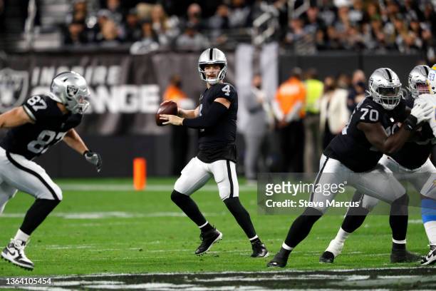 Quarterback Derek Carr of the Las Vegas Raiders looks to pass during a game against the Los Angeles Chargers at Allegiant Stadium on January 09, 2022...