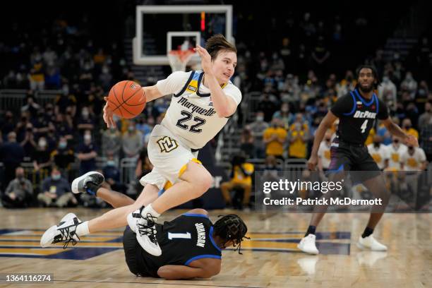 Tyler Kolek of the Marquette Golden Eagles collides with Javan Johnson of the DePaul Blue Demons in the first half at Fiserv Forum on January 11,...