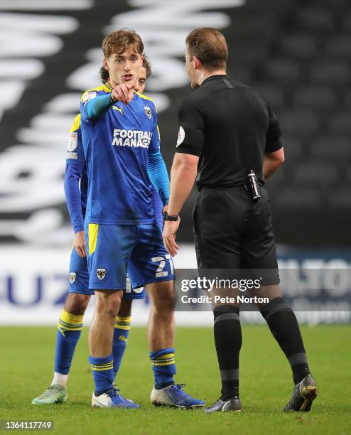 Luke McCormick of AFC Wimbledon makes a point to referee Anthony Backhouse during the Sky Bet League One match between Milton Keynes Dons and AFC...