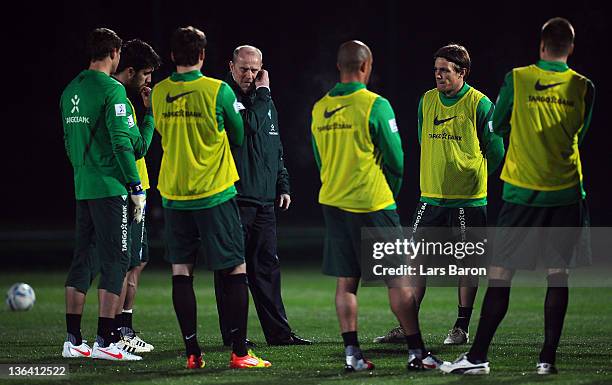 Head coach Thomas Schaaf gives instructions to his players during a training session at day one of Werder Bremen training camp on January 4, 2012 in...