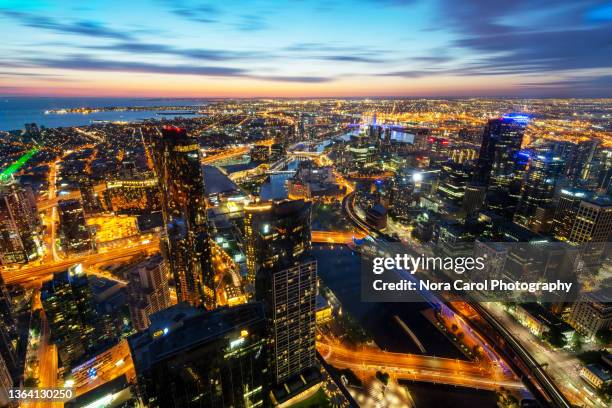 melbourne night skyline - melbourne australia aerial stock pictures, royalty-free photos & images