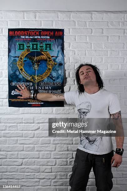 Dani Filth of English extreme metal band Cradle Of Filth, posing with a poster for Bloodstock Festival 2009. During a portrait shoot on June 24, 2009.