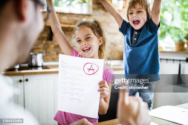 yay daddy, i've got an a on my exam! - a grade stock pictures, royalty-free photos & images