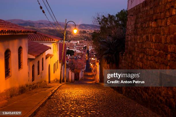 old streets of the colonial city of sucre at dusk, bolivia - sucre stock pictures, royalty-free photos & images