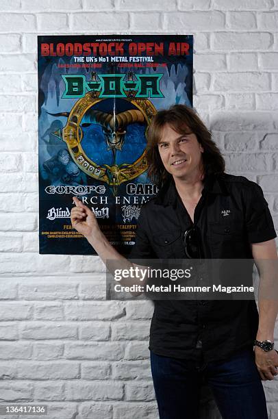 Joey Tempest of Swedish heavy metal band Europe, posing with a poster for Bloodstock Festival 2009. During a portrait shoot on June 24, 2009.