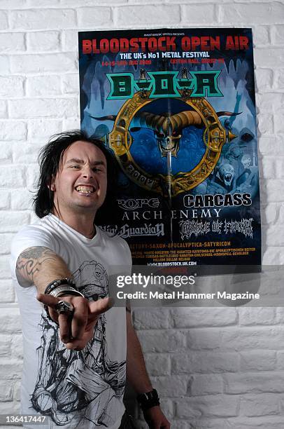 Dani Filth of English extreme metal band Cradle Of Filth, posing with a poster for Bloodstock Festival 2009. During a portrait shoot on June 24, 2009.