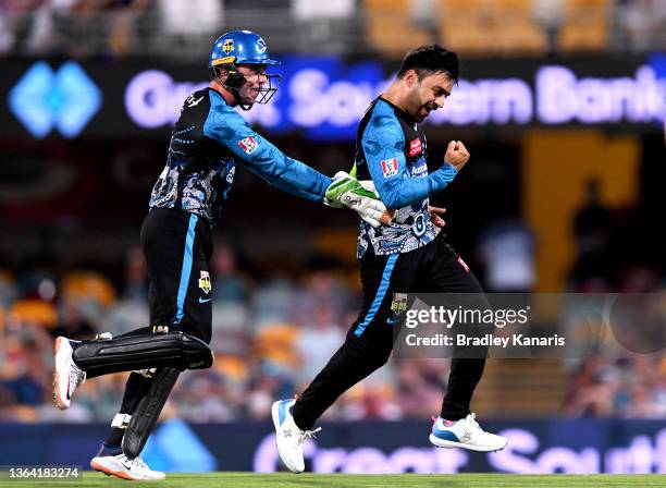 Rashid Khan of the Strikers celebrates taking the wicket of Jake Lehmann of the Heat during the Men's Big Bash League match between the Brisbane Heat...