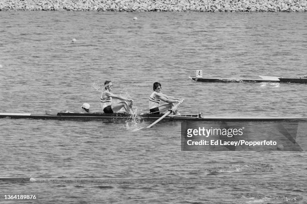 British rowers Neil Christie and James MacLeod along with cox David Webb of the Great Britain team compete in the quarterfinals to finish in 7th...