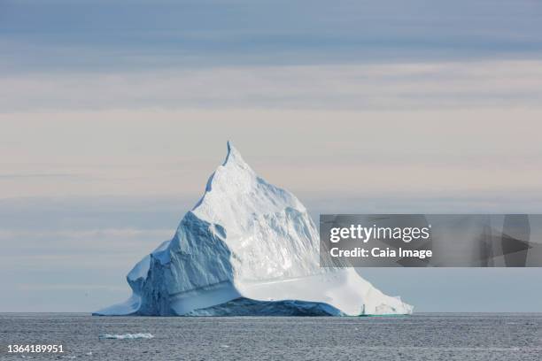 majestic iceberg formation on atlantic ocean greenland - eisberg eisgebilde stock-fotos und bilder