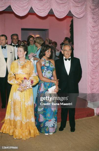 Princesse Grace, Prince Rainier III, and Princesse Caroline of Monaco attend the gala of the Croix Rouge Monegasque, in Monaco, 04 August 1973.