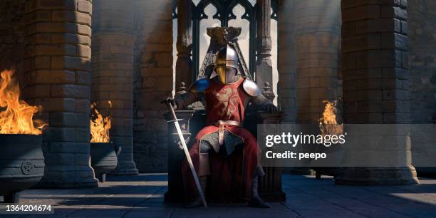 un cavaliere in armatura con la spada seduto sul trono nel castello - squire foto e immagini stock